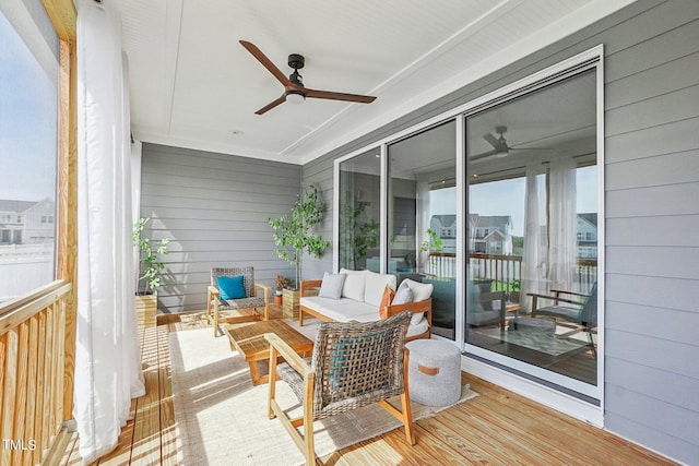 sunroom featuring ceiling fan