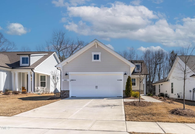 view of front of property featuring a garage and concrete driveway