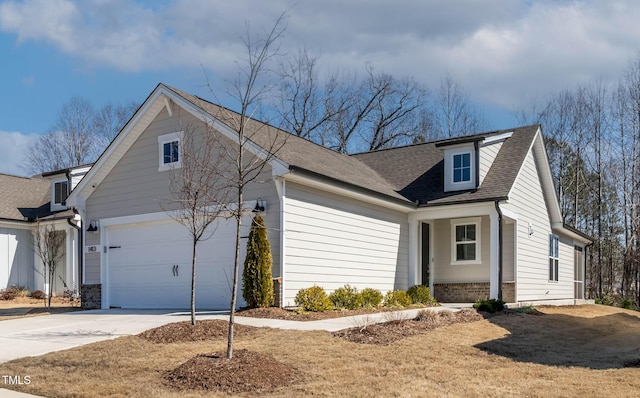 view of property exterior with a shingled roof, brick siding, driveway, and an attached garage