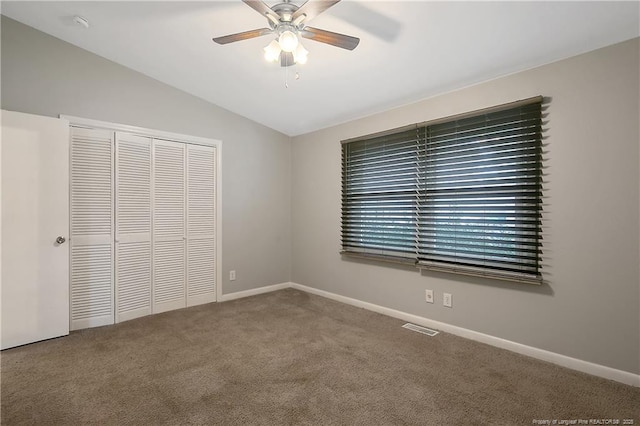 4442 Wellington Dr, Fayetteville, NC 28314 - unfurnished bedroom with a closet, visible vents, carpet flooring, vaulted ceiling, and baseboards
