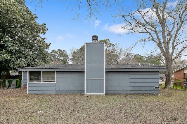 4442 Wellington Dr, Fayetteville, NC 28314 - rear view of property with a chimney