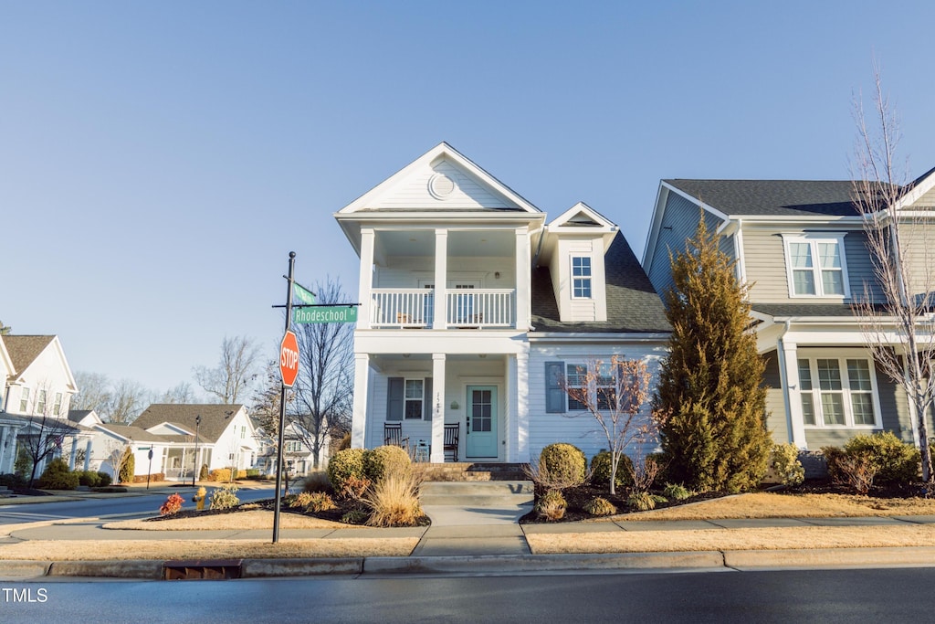 view of front of home featuring a balcony