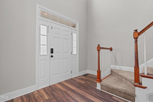 foyer entrance featuring dark hardwood / wood-style floors