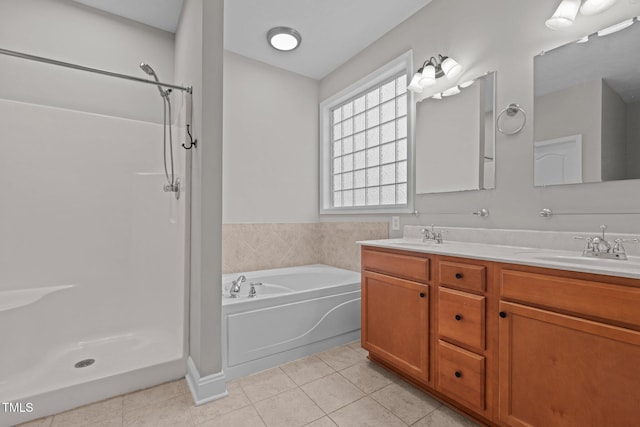 bathroom with independent shower and bath, vanity, and tile patterned floors