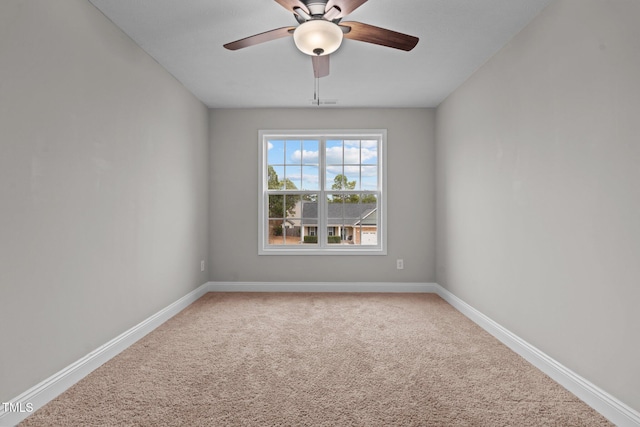 empty room featuring ceiling fan and carpet flooring