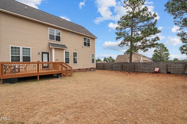 back of house featuring a wooden deck