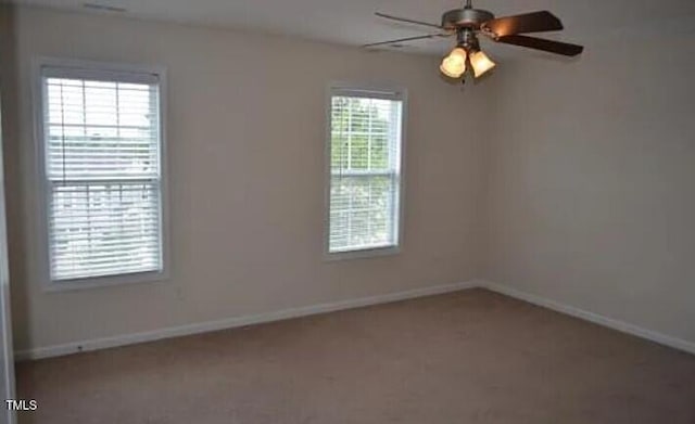 spare room with ceiling fan