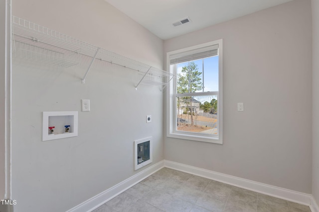 laundry area featuring hookup for a washing machine, visible vents, hookup for an electric dryer, laundry area, and baseboards