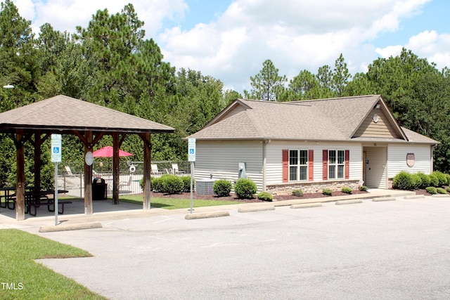 view of home's community featuring fence and a gazebo