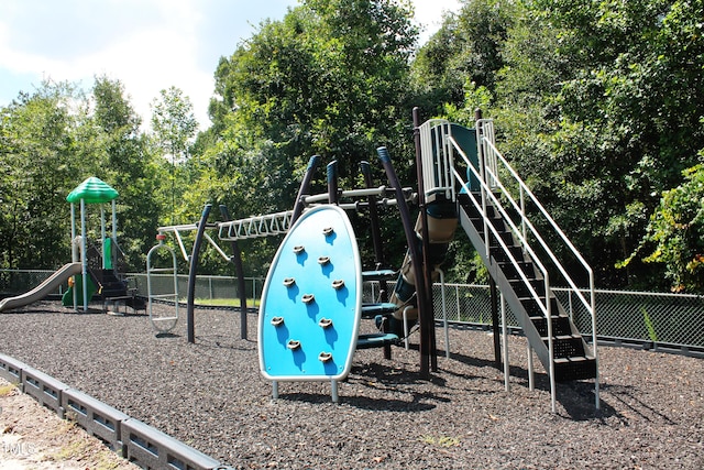 communal playground featuring fence