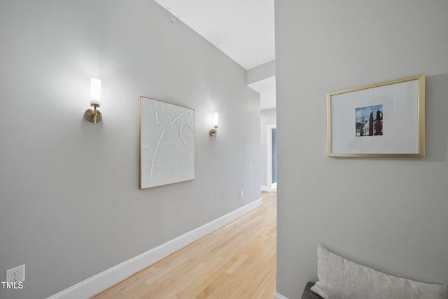 hall with hardwood / wood-style floors