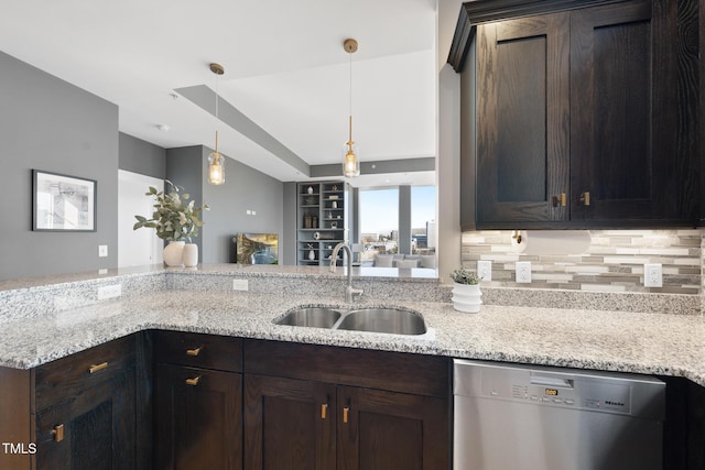 kitchen with sink, dark brown cabinets, dishwasher, pendant lighting, and light stone countertops