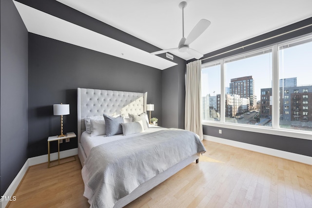 bedroom featuring ceiling fan and light hardwood / wood-style floors