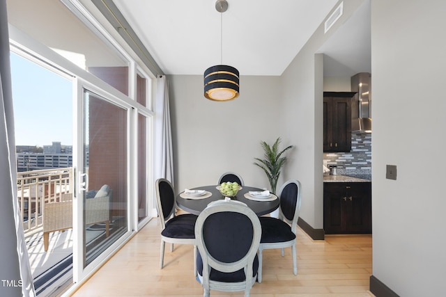 dining space featuring light hardwood / wood-style floors