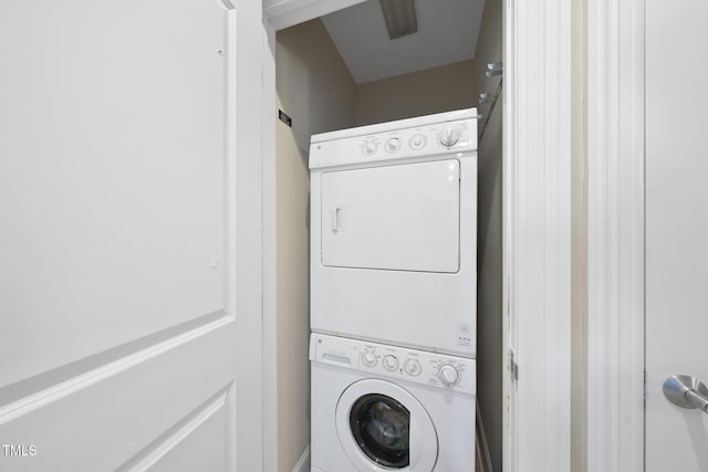 laundry area with stacked washer and clothes dryer