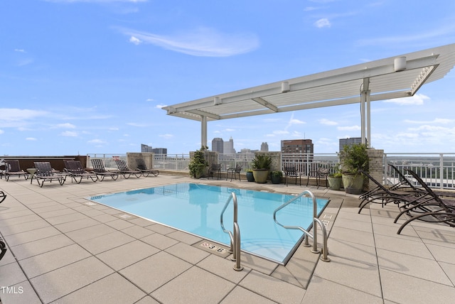 view of swimming pool featuring a pergola and a patio area