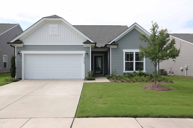 view of front facade featuring a garage and a front lawn