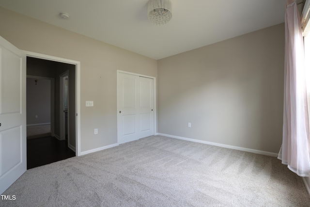 unfurnished bedroom featuring carpet flooring