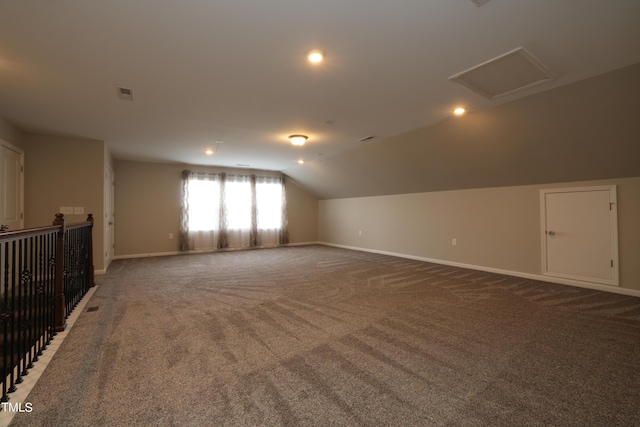 additional living space with vaulted ceiling and carpet