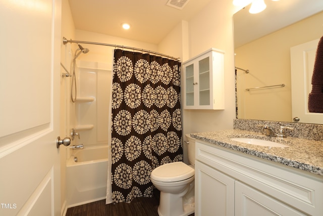 full bathroom with vanity, toilet, shower / tub combo, and wood-type flooring