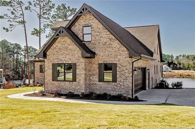 view of home's exterior featuring a garage and a yard