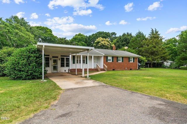 view of front facade with a carport and a front yard