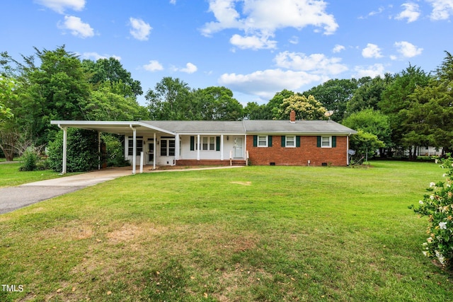 ranch-style home featuring a front yard and a carport