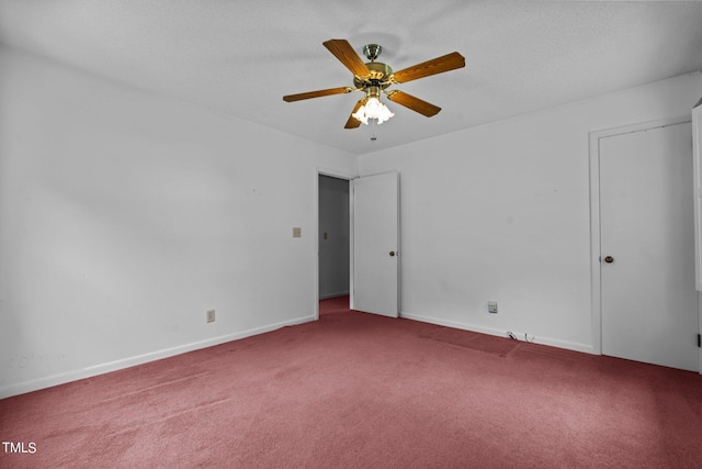 unfurnished room featuring carpet, a textured ceiling, and ceiling fan