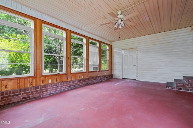 unfurnished sunroom with a wealth of natural light, wooden ceiling, ceiling fan, and cooling unit