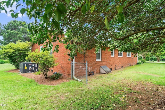 view of home's exterior with a lawn