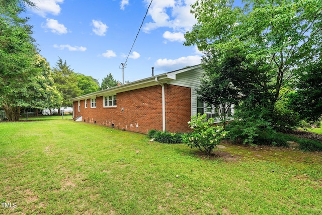 view of property exterior featuring a lawn