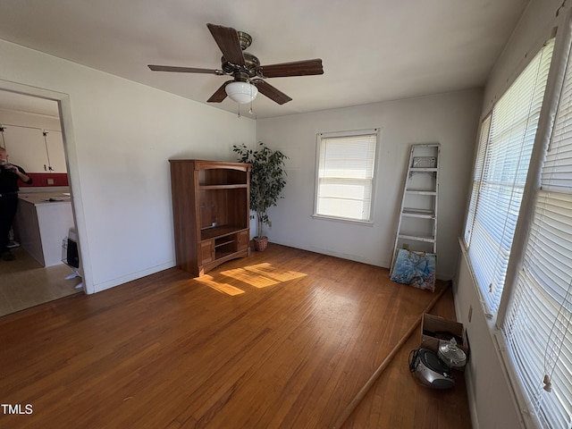 interior space with hardwood / wood-style flooring and ceiling fan