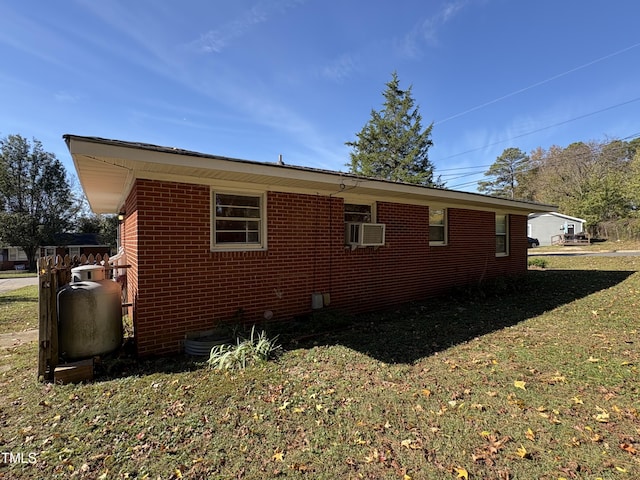 view of home's exterior featuring a yard and cooling unit