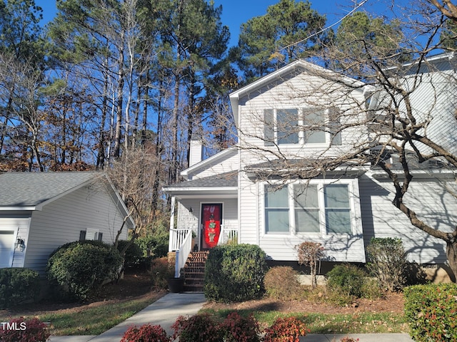 view of front of home featuring a chimney