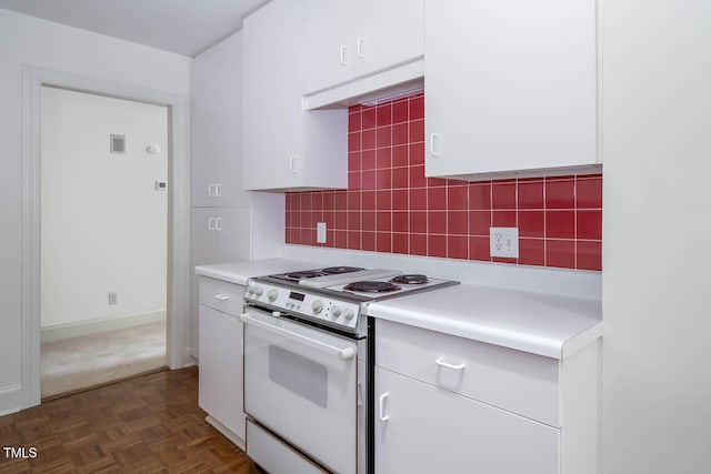 kitchen with decorative backsplash, white cabinetry, light countertops, and white electric range oven