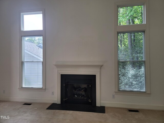 595 Weathersfield Unit A, Pittsboro, NC 27312 - details featuring visible vents, baseboards, carpet floors, and a fireplace with flush hearth
