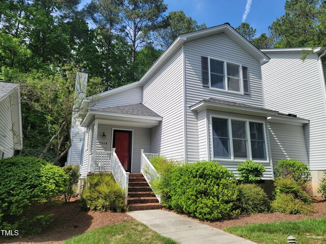 595 Weathersfield Unit A, Pittsboro, NC 27312 - traditional-style house with a shingled roof and a chimney