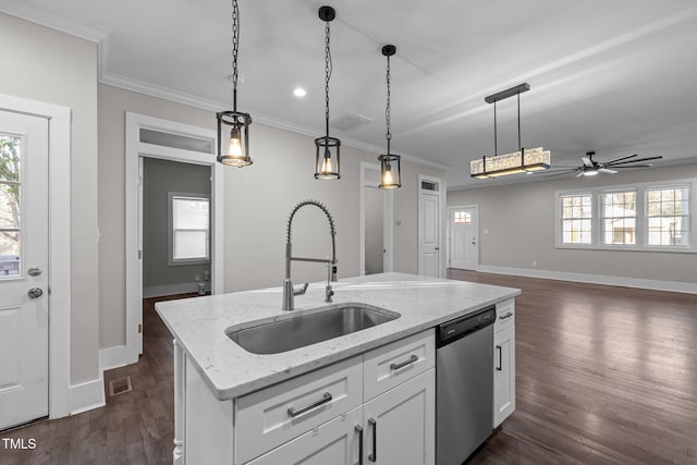 kitchen featuring sink, hanging light fixtures, a center island with sink, stainless steel dishwasher, and white cabinets