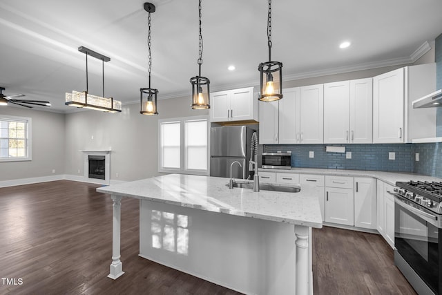 kitchen with white cabinetry, appliances with stainless steel finishes, and sink