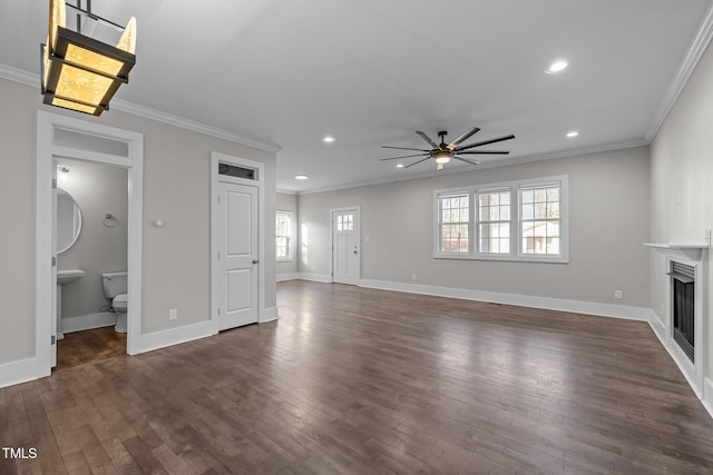 unfurnished living room with crown molding, ceiling fan, and dark hardwood / wood-style flooring