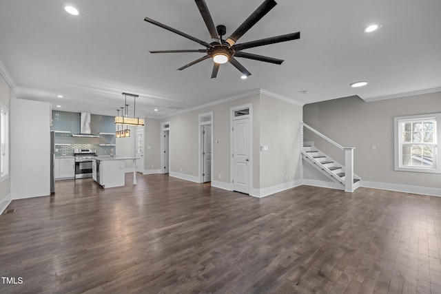 unfurnished living room featuring crown molding, ceiling fan, and dark hardwood / wood-style flooring