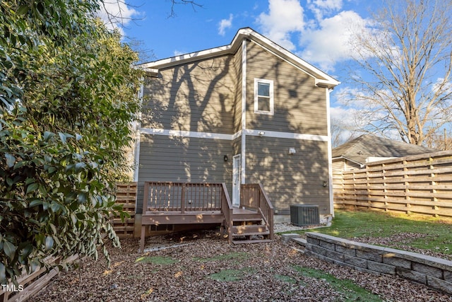 back of house with central AC and a deck