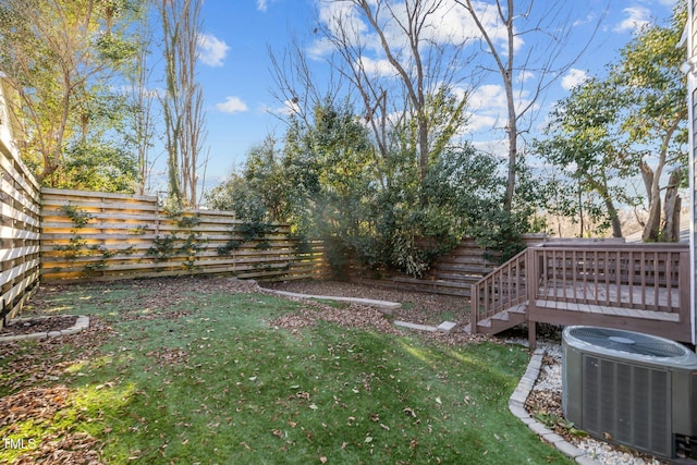 view of yard with a wooden deck and central AC