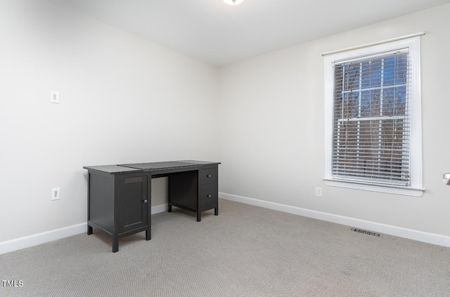 home office featuring light carpet