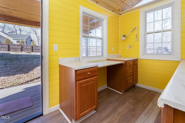 bathroom featuring hardwood / wood-style flooring, vaulted ceiling, wood ceiling, and wood walls