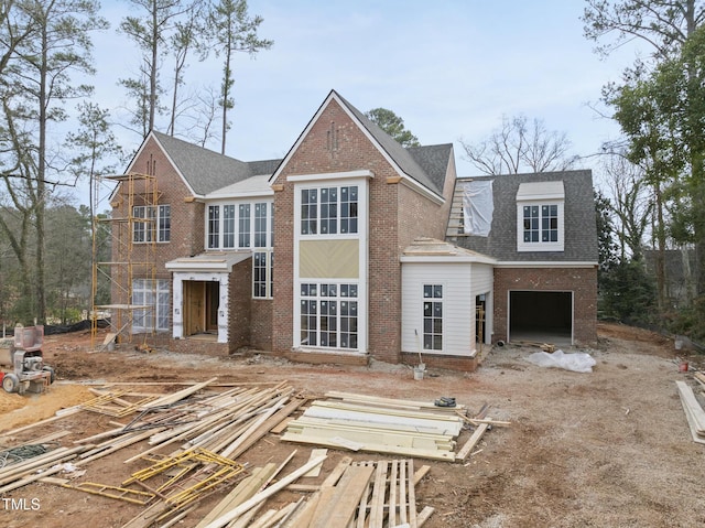 back of house featuring a garage