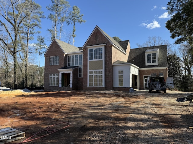 traditional home with brick siding