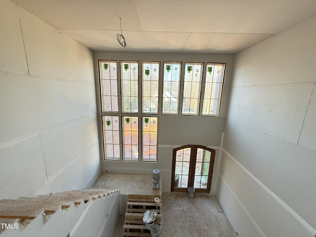 doorway to outside with arched walkways and french doors