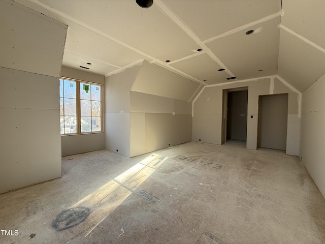 additional living space with lofted ceiling