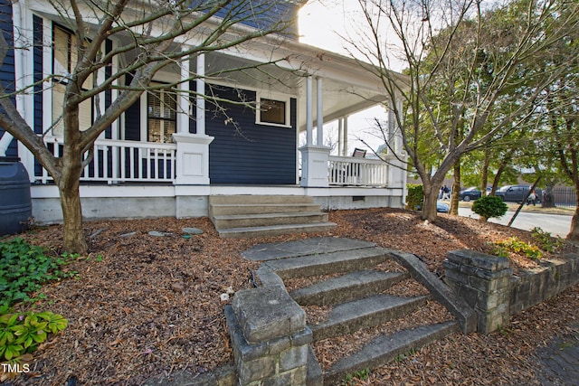 property entrance with covered porch